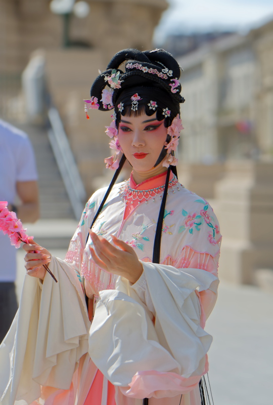 19 - Chinese woman performer dressed in traditional attire consistent with Chinese opera